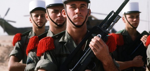 An honor guard from the French army's 6th Battalion stands at attention as they await the arrival of Lt. Gen. Khalid Bin Sultan Bin Abdul Aziz, commander of Joint Forces in Saudi Arabia, during Operation Desert Shield.  The soldier in front is holding a 5.56mm FA MAS rifle, equipped with a bayonet.